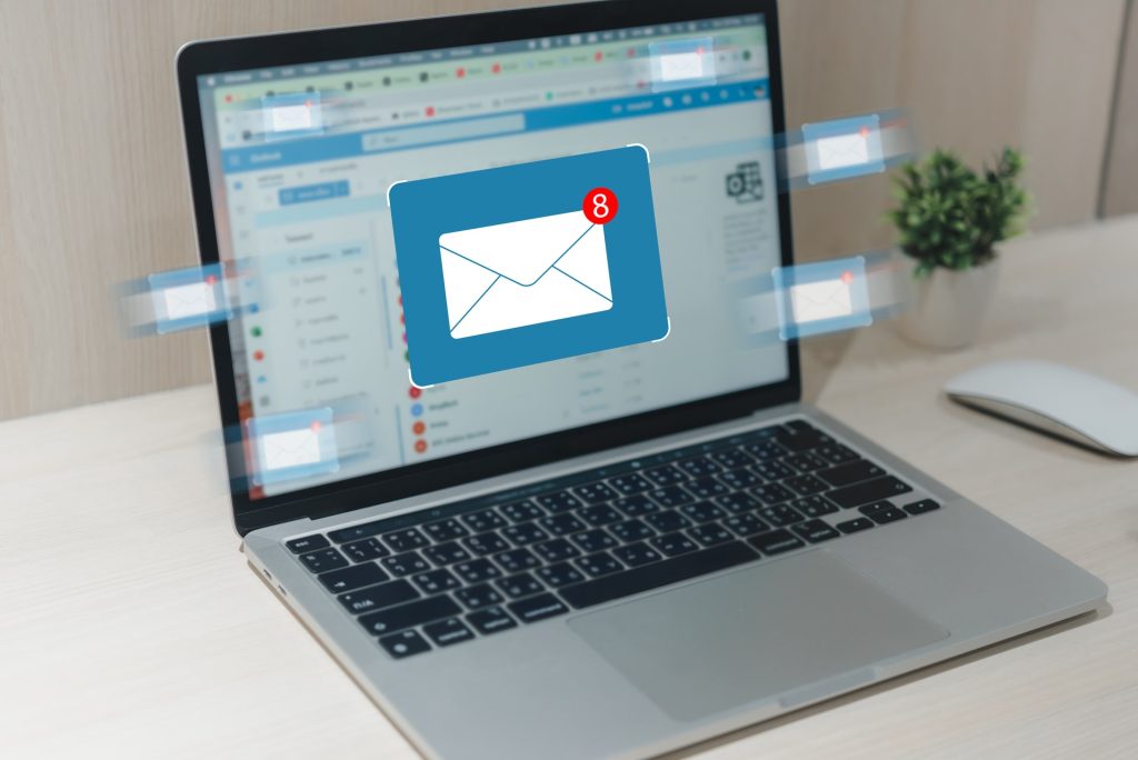 E-mail message marketing online and network social media communication information concept icon envelope connection on screen laptop.