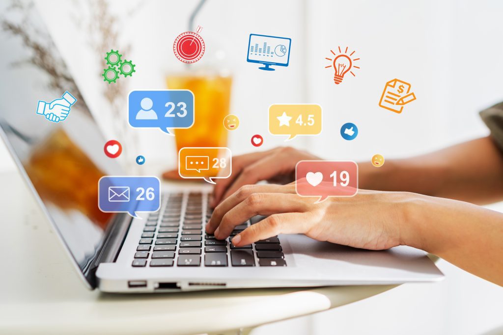 Creative young woman sitting and working on laptop at office, Digital marketing and Business Analytics and Data Management System concepts.