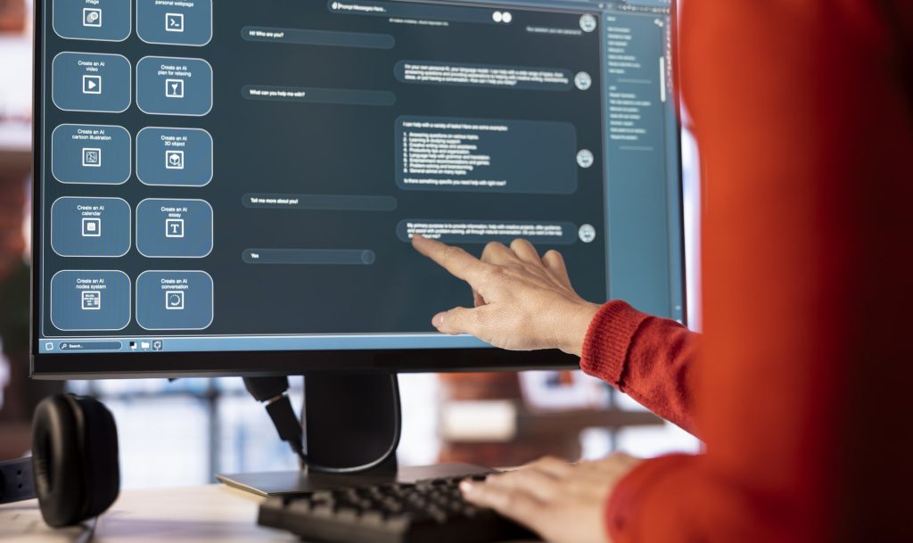 Woman uses chatbot system on a computer to guide her through problem solving tasks, futuristic technology highlights smart algorithms and machine learning. Online communication and support.